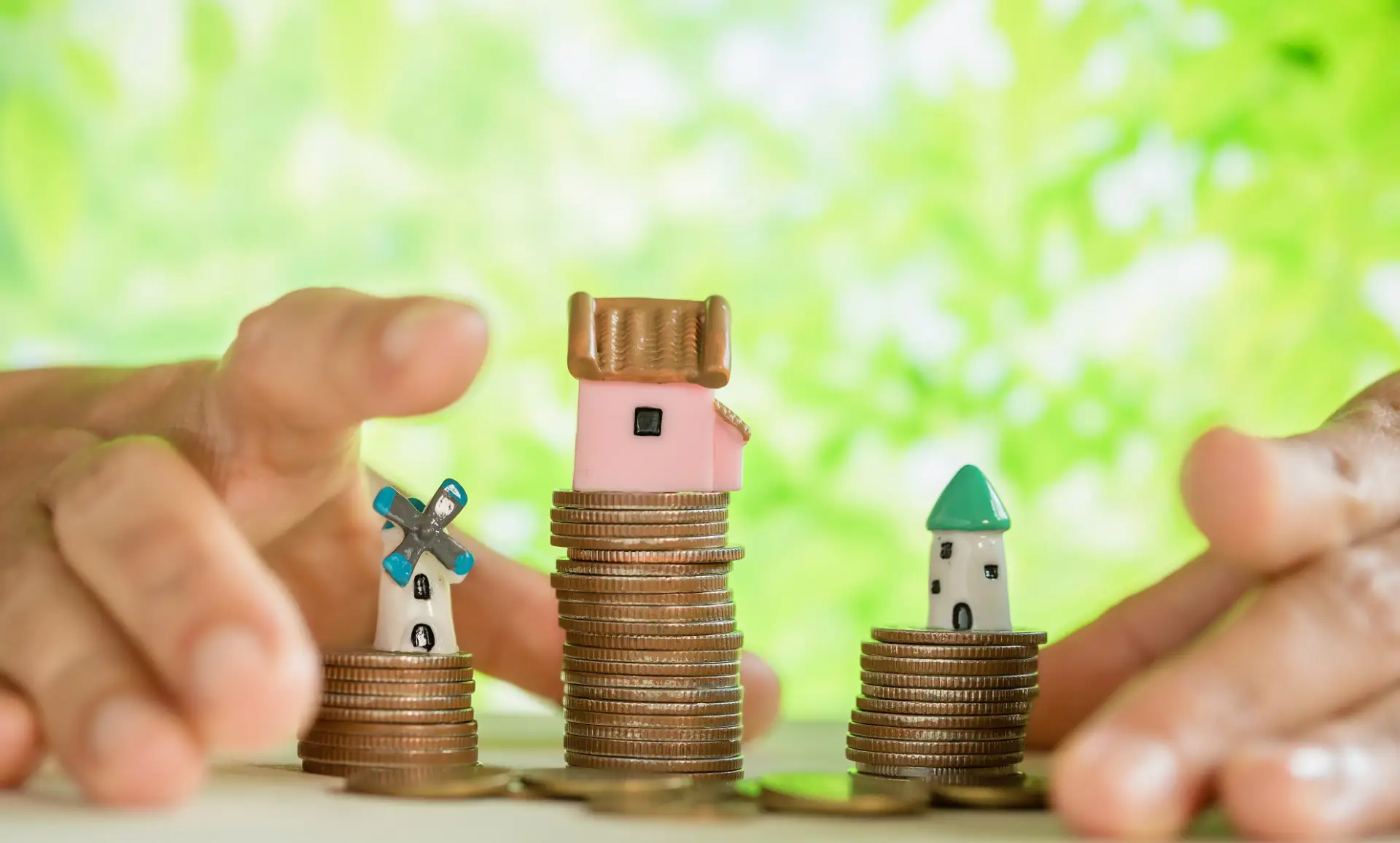 Hand pampered coins and small house model